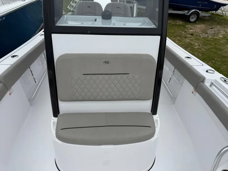 Slide: The Image of 2025 Sportsman Open 212 Center Console boat interior with cushioned seating and sleek design. - 7