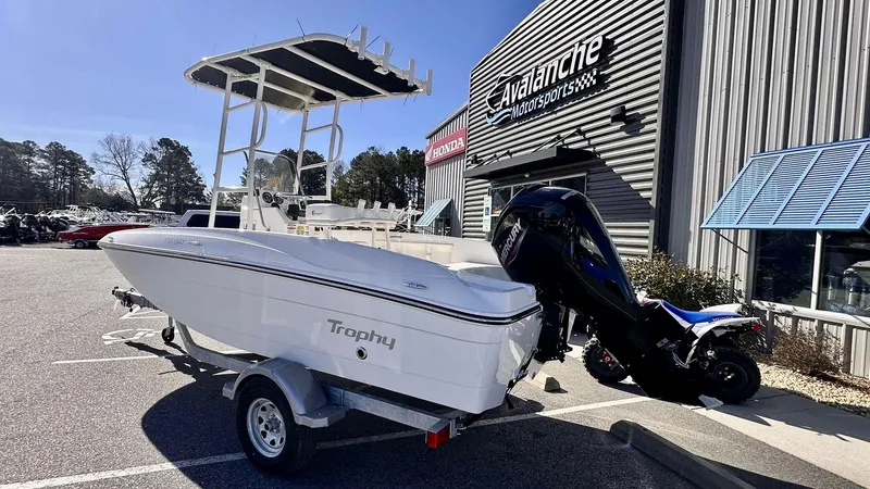 The Image of 2025 Bayliner T18 Limited Edition boat on trailer outside dealership. - 0