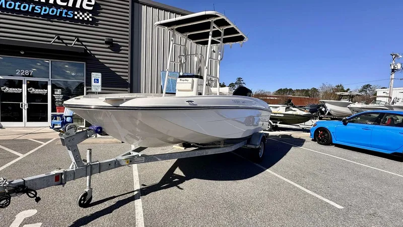 Slide: The Image of 2025 Bayliner T18 Limited Edition boat on trailer outside dealership. - 3