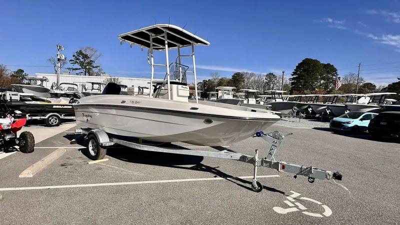 Slide: The Image of 2025 Bayliner T18 Limited Edition boat on trailer in parking lot. - 5