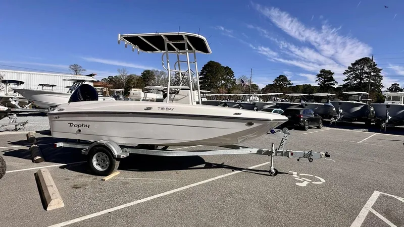 Slide: The Image of 2025 Bayliner T18 Limited Edition boat on trailer in parking lot. - 6