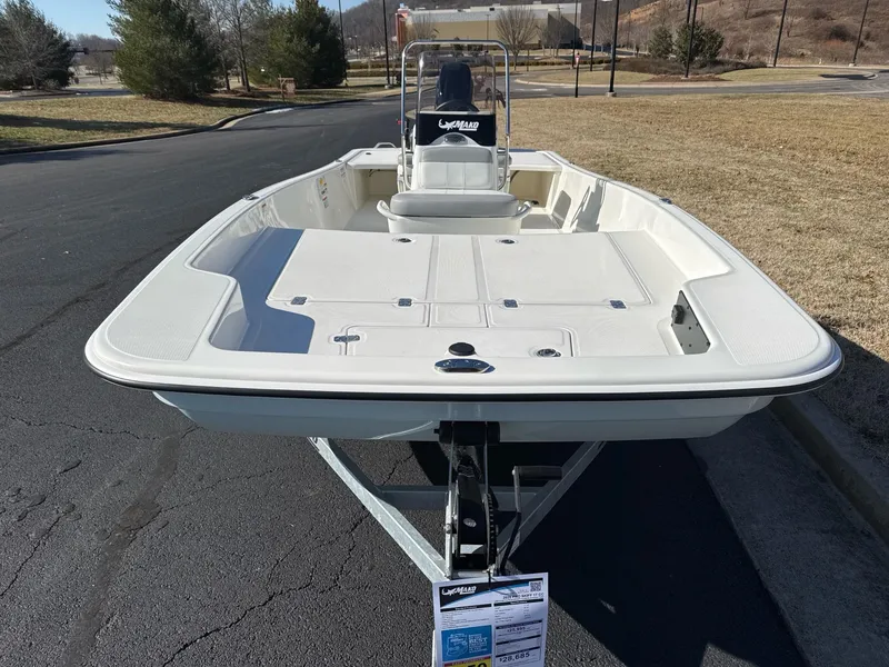 Slide: The Image of 2025 Mako Pro Skiff 17 CC boat on trailer, parked outdoors. - 7