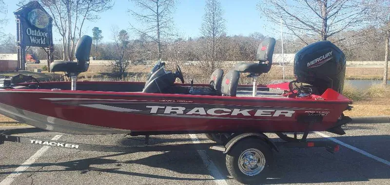 Slide: The Image of 2025 Tracker Pro Team 175 Crappie Edition boat in parking lot, side view. - 6