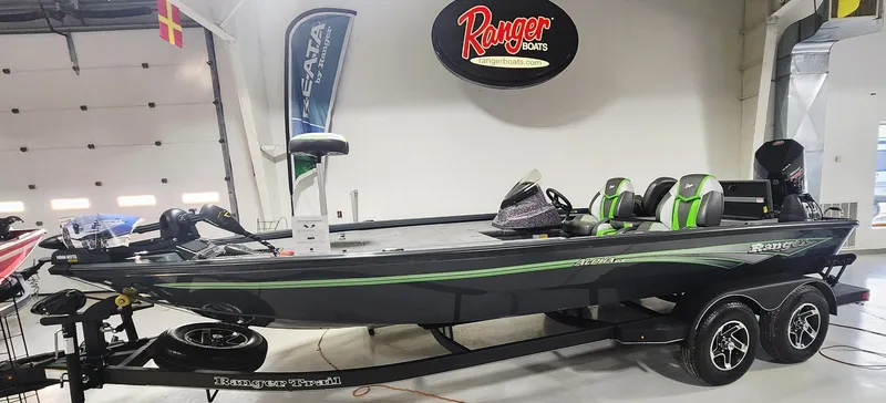 The Image of 2025 Ranger ALPHA 208 boat on trailer in showroom, featuring sleek design and modern features. - 1