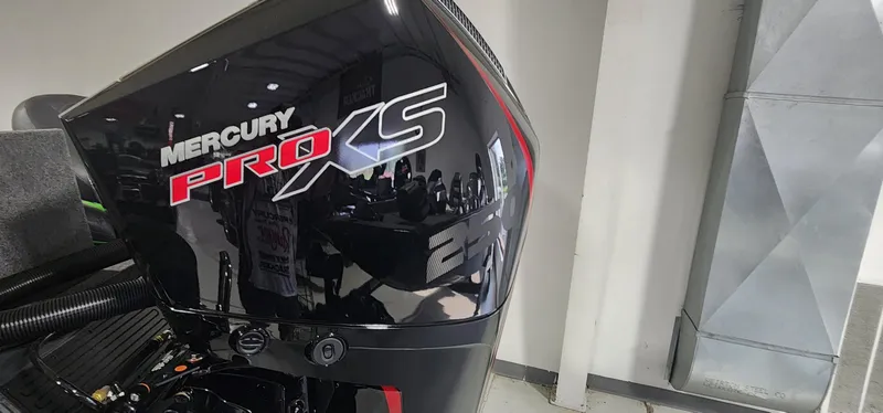 Slide: The Image of Mercury Pro XS engine on Ranger ALPHA 208, 2025 model, in a showroom setting. - 11