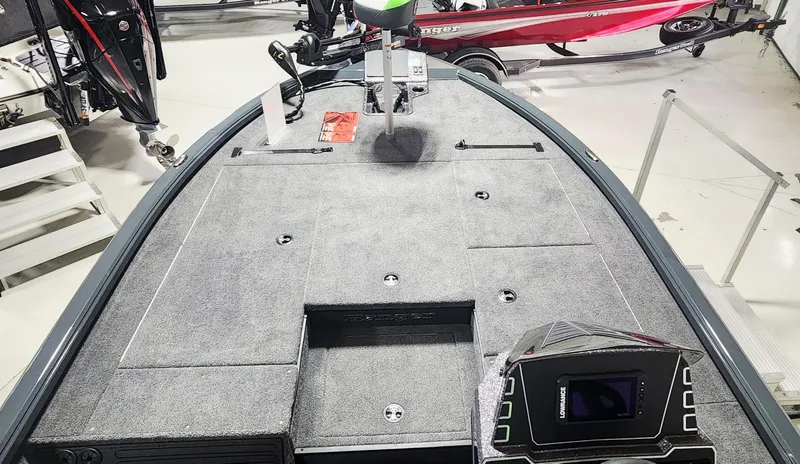 Slide: The Image of 2025 Ranger ALPHA 208 boat interior with advanced navigation system and spacious deck. - 2