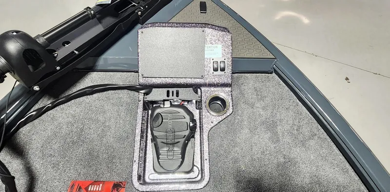 Slide: The Image of 2025 Ranger ALPHA 208 boat control panel with foot pedal and switches. - 3