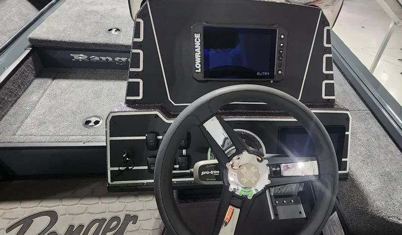 Slide: The Image of Cockpit of 2025 Ranger ALPHA 208 boat with Lowrance Elite display and steering wheel. - 6