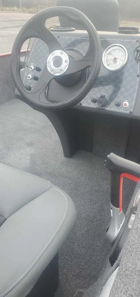 Slide: The Image of 2025 Tracker Bass Tracker Classic XL interior with steering wheel and dashboard. - 3