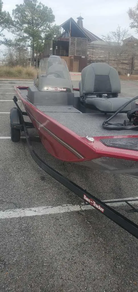 Slide: The Image of 2025 Tracker Bass Tracker Classic XL boat on trailer in parking lot. - 5
