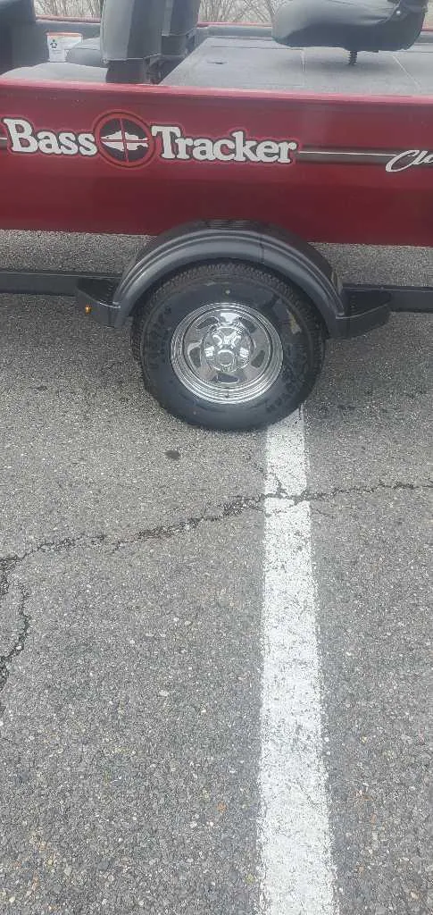 Slide: The Image of 2025 Tracker Bass Tracker Classic XL boat trailer parked on asphalt. - 6