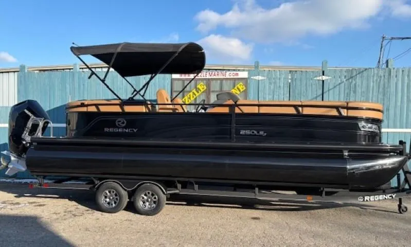 Slide: The Image of 2024 Regency 250 LE3 pontoon boat with black exterior on a trailer. - 0