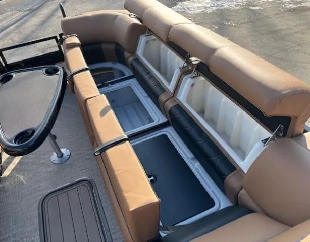 Slide: The Image of 2024 Regency 250 LE3 boat interior with open storage compartments and seating. - 11