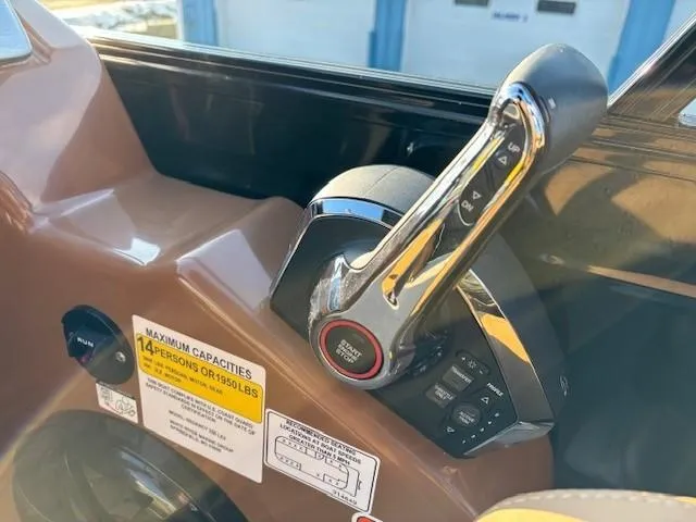 Slide: The Image of 2024 Regency 250 LE3 boat throttle control with capacity label for 14 persons. - 21