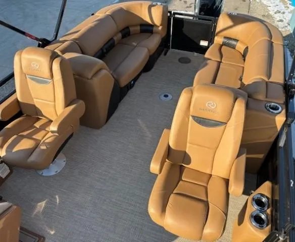 Slide: The Image of 2024 Regency 250 LE3 boat interior with tan leather seating and cup holders. - 25