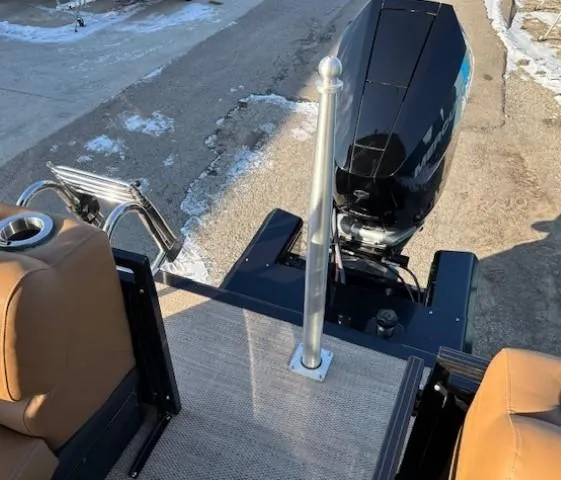 Slide: The Image of 2024 Regency 250 LE3 boat with outboard motor and seating area. - 31