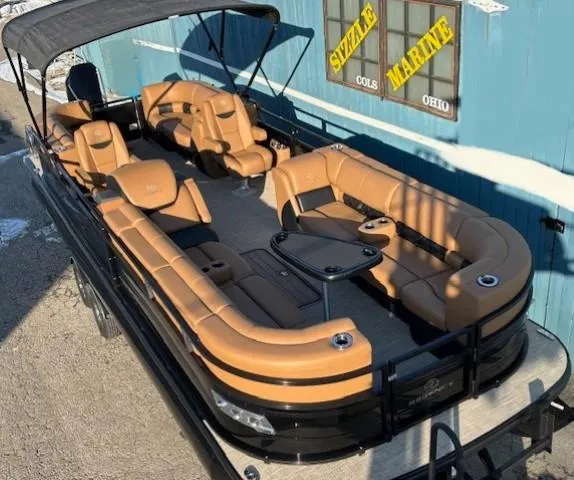 Slide: The Image of 2024 Regency 250 LE3 pontoon boat with tan seating, docked at Sizzle Marine, Ohio. - 7
