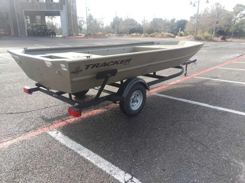 Slide: The Image of 2025 Tracker Grizzly 1754 Jon boat on trailer in parking lot. - 3