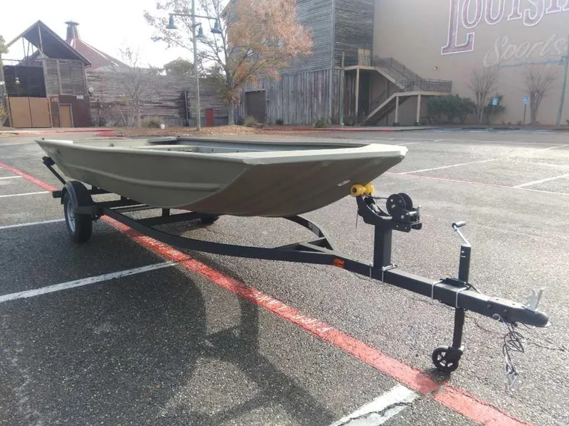 Slide: The Image of 2025 Tracker Grizzly 1754 Jon boat on trailer in parking lot. - 5