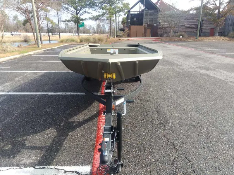 Slide: The Image of 2025 Tracker Grizzly 1754 Jon boat on trailer in parking lot. - 6