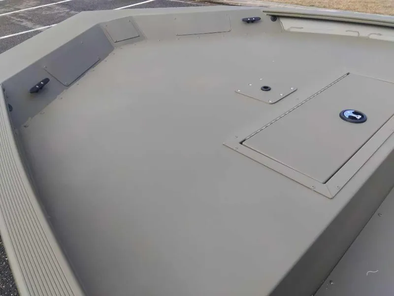 Slide: The Image of 2025 Tracker Grizzly 1754 Jon boat deck, featuring storage compartments and a sleek design. - 8