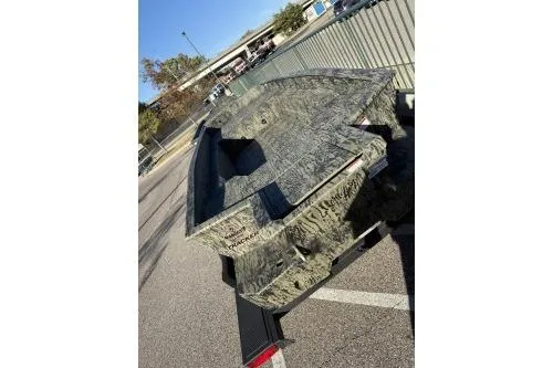 Slide: The Image of 2025 Tracker Grizzly 1650 T Prairie Wings Edition boat with camouflage design. - 2