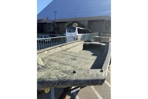 Slide: The Image of 2025 Tracker Grizzly 1650 T Prairie Wings Edition boat displayed at Bass Pro Shops. - 3