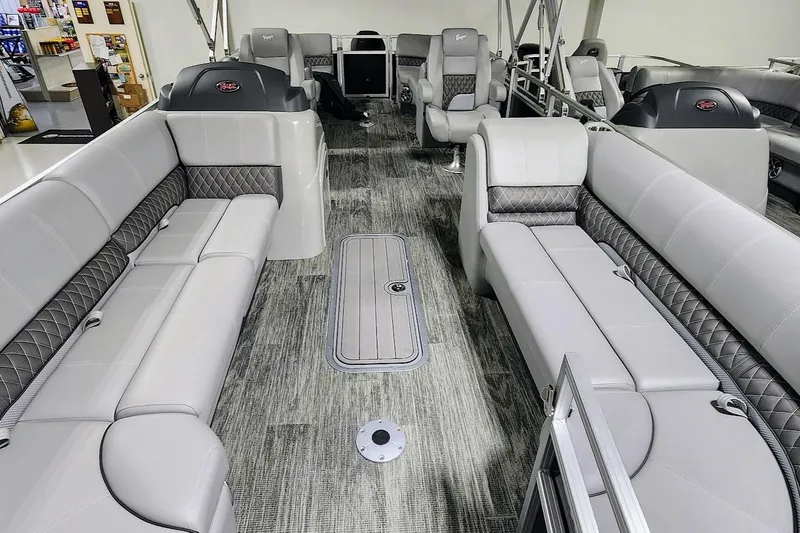 Slide: The Image of 2025 Ranger Reata 243C pontoon boat interior with luxurious seating and modern design. - 3
