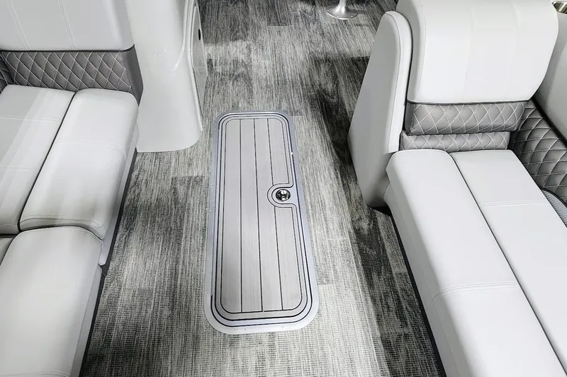 Slide: The Image of 2025 Ranger Reata 243C interior with luxurious seating and sleek flooring design. - 7