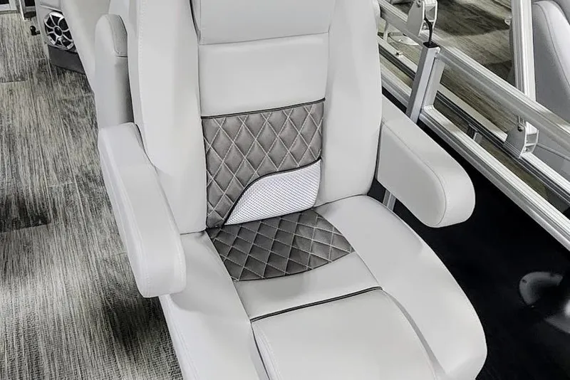 Slide: The Image of Luxurious seating in 2025 Ranger Reata 243C boat with quilted design and armrests. - 9