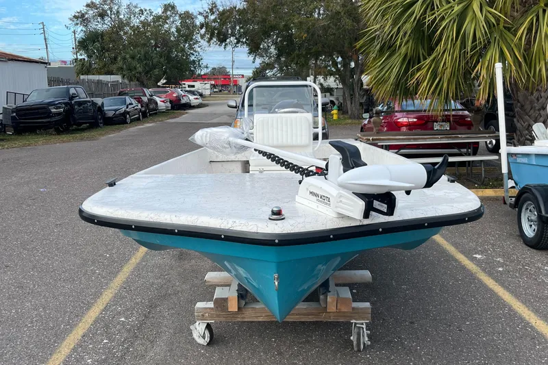 Slide: The Image of 2025 Rabco 16' Buccaneer boat on trailer, parked outdoors. - 4