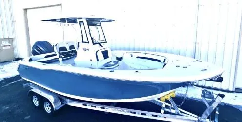Slide: The Image of 2025 Tidewater 232 LXF boat on trailer, featuring sleek design and modern amenities. - 2