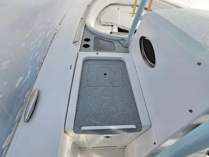 Slide: The Image of 2017 Southport 33 LX boat interior with sink and storage area. - 12