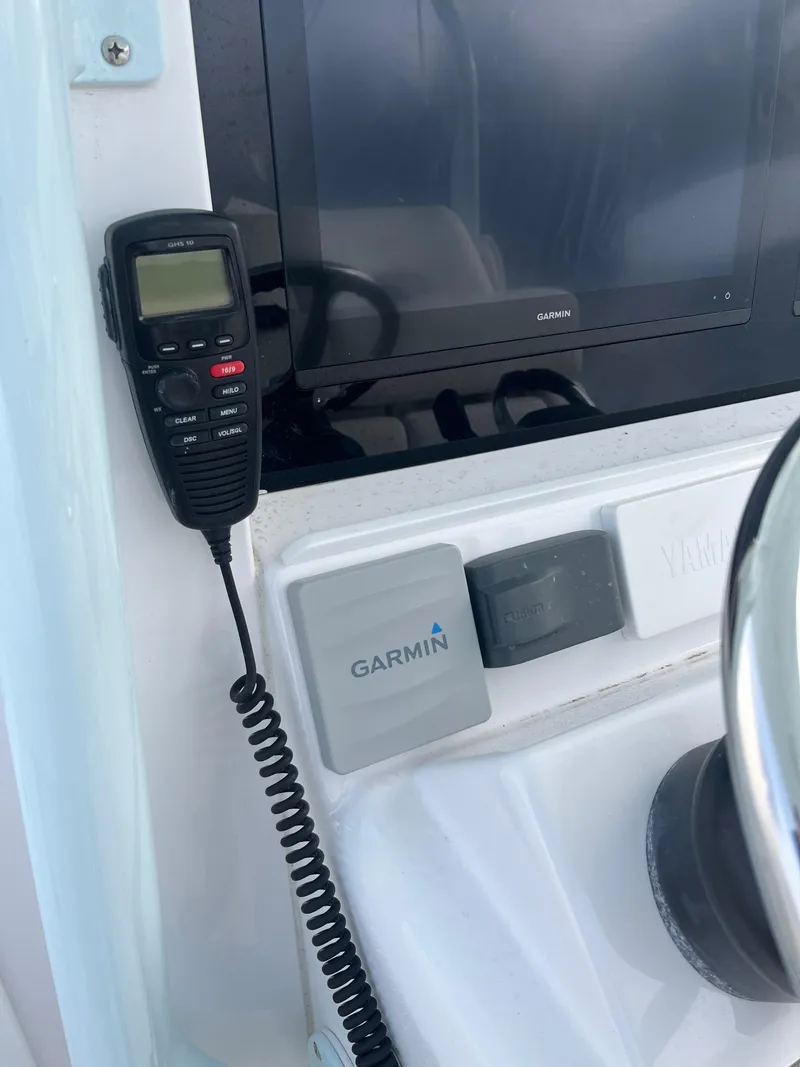 Slide: The Image of 2017 Southport 33 LX boat dashboard with Garmin navigation and communication equipment. - 16