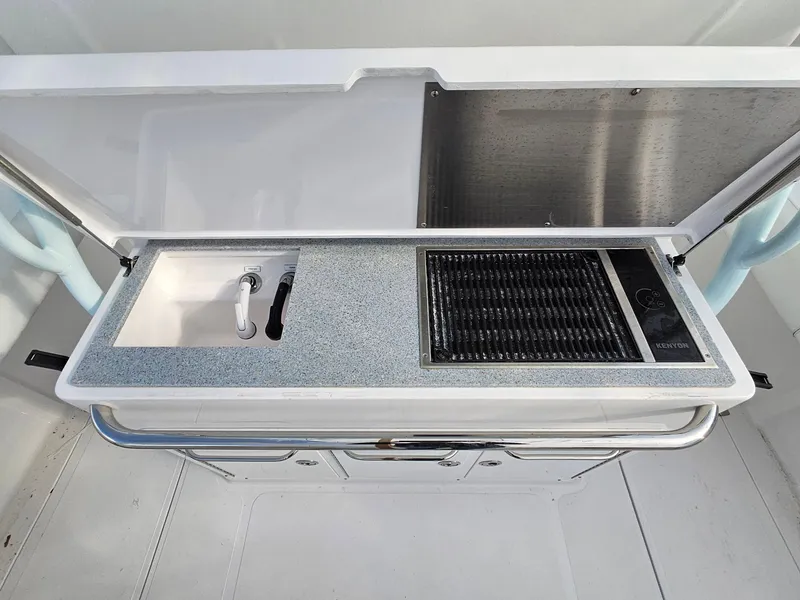 Slide: The Image of 2017 Southport 33 LX boat kitchenette with sink and grill. - 7