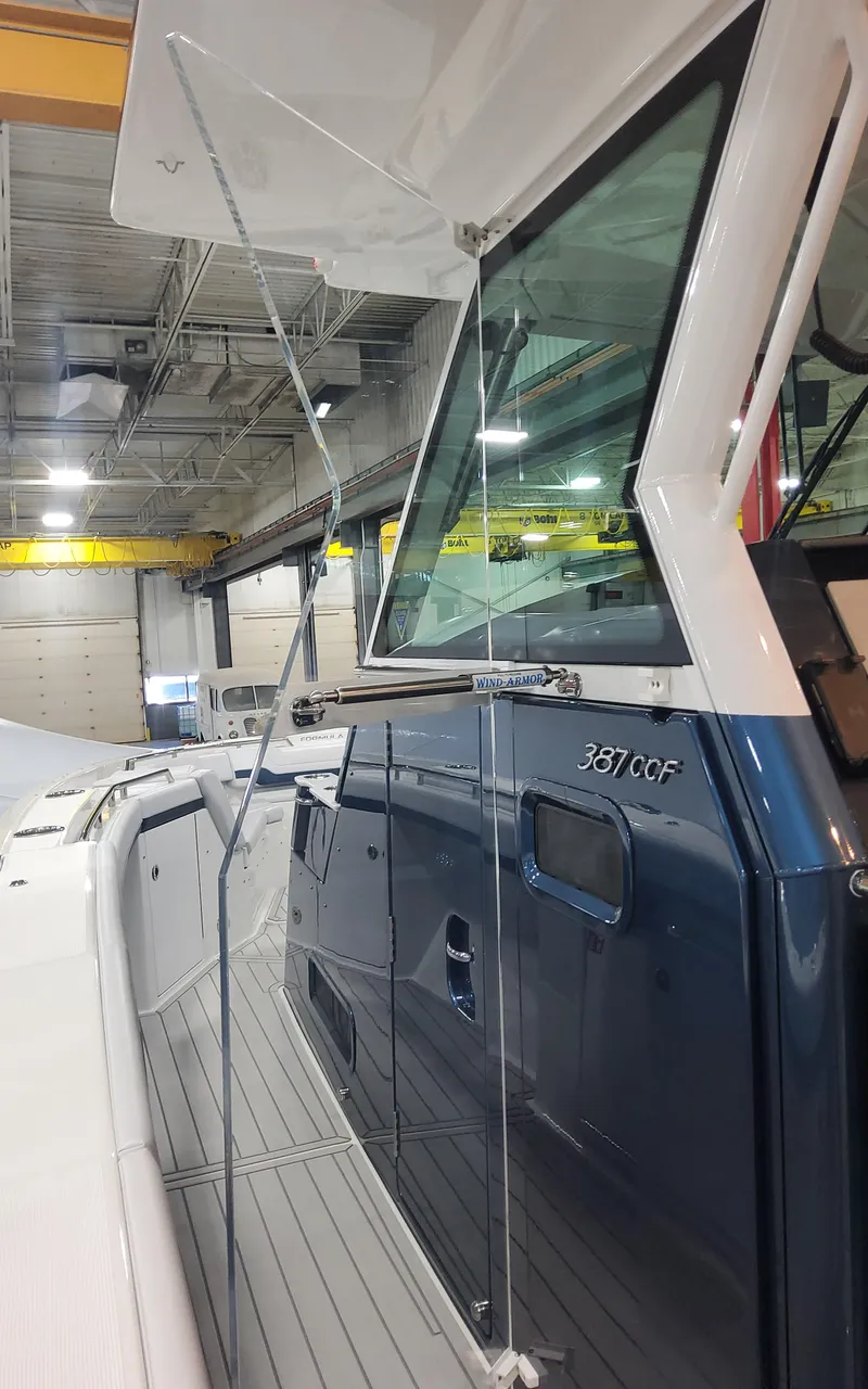 Slide: The Image of 2025 Formula 387 Center Console Fish boat in a showroom, showcasing sleek design and modern features. - 12