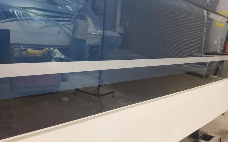 Slide: The Image of 2025 Formula 387 Center Console Fish boat in a workshop setting. - 2