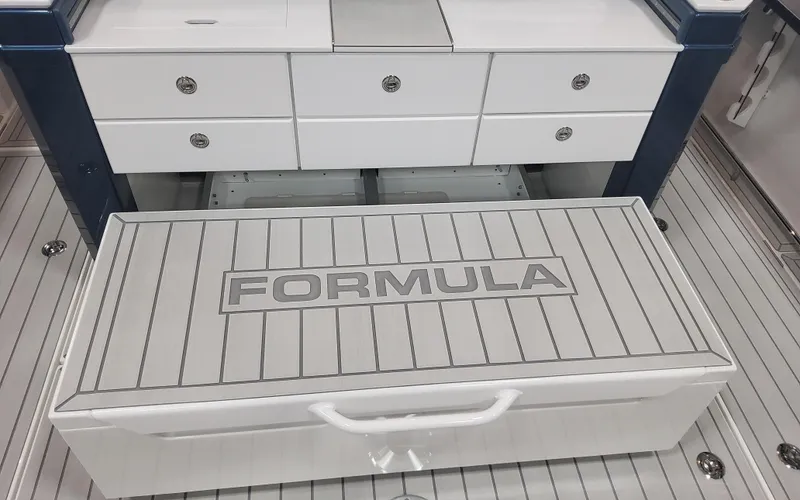 Slide: The Image of 2025 Formula 387 Center Console Fish boat interior with storage compartments. - 26
