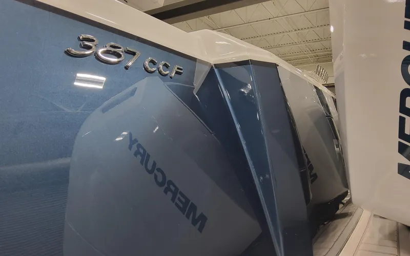 Slide: The Image of 2025 Formula 387 Center Console Fish boat with Mercury engines in a showroom. - 3