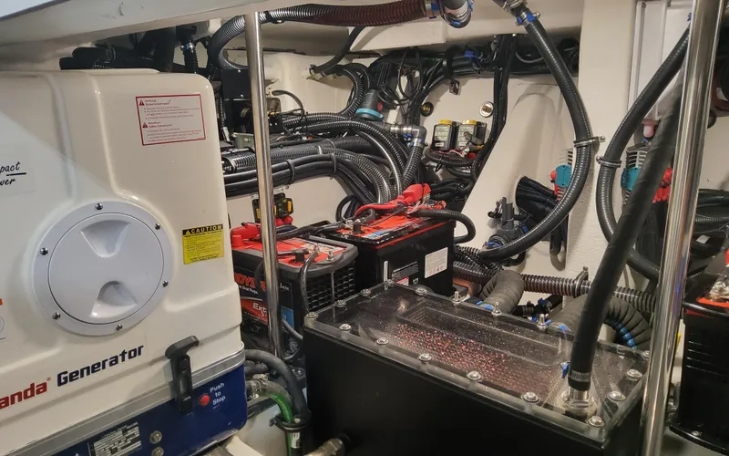 Slide: The Image of Engine room of 2025 Formula 387 Center Console Fish with generator and wiring. - 31