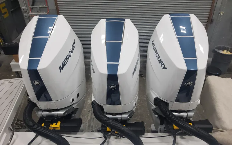 Slide: The Image of Three Mercury outboard engines on a 2025 Formula 387 Center Console Fish boat. - 33