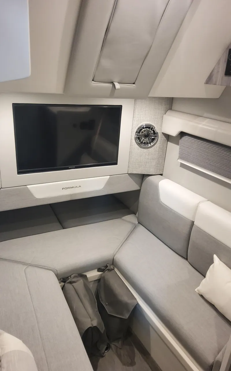 Slide: The Image of 2025 Formula 387 Center Console Fish interior with modern seating and entertainment system. - 35
