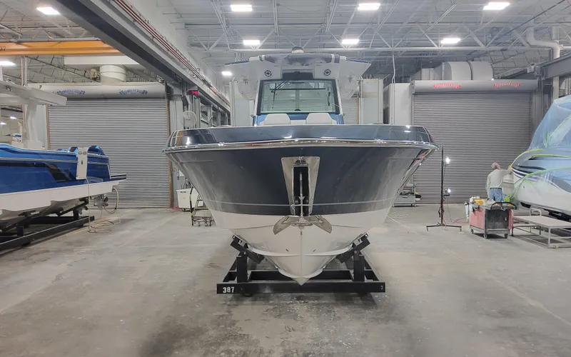 Slide: The Image of 2025 Formula 387 Center Console Fish boat in a workshop setting. - 4