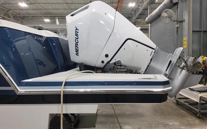 Slide: The Image of 2025 Formula 387 Center Console Fish boat with Mercury outboard engine in a workshop. - 46