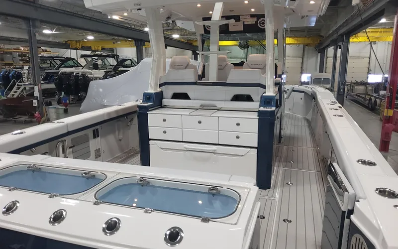Slide: The Image of 2025 Formula 387 Center Console Fish boat interior in a showroom setting. - 7