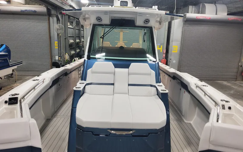 Slide: The Image of 2025 Formula 387 Center Console Fish boat in a garage setting. - 8