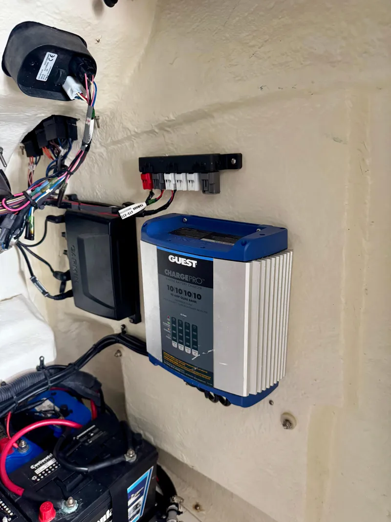 Slide: The Image of 2020 BlackJack 256 Bay boat electrical system with battery charger and wiring. - 19