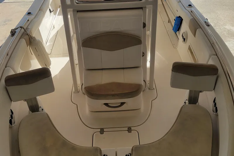 Slide: The Image of 2018 Robalo R222 Center Console boat interior with seating and storage. - 10