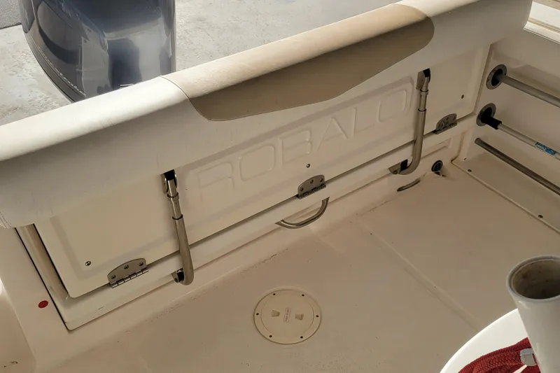Slide: The Image of 2018 Robalo R222 Center Console boat interior with storage compartment and seating. - 5