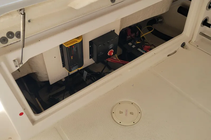 Slide: The Image of 2018 Robalo R222 Center Console boat interior wiring and battery compartment. - 7
